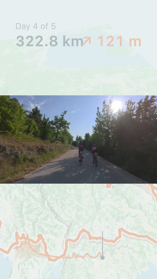 An action-cam clip of two riders on a shaded back road, framed by the map above and below.